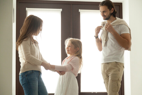 Mom and daughter with dad