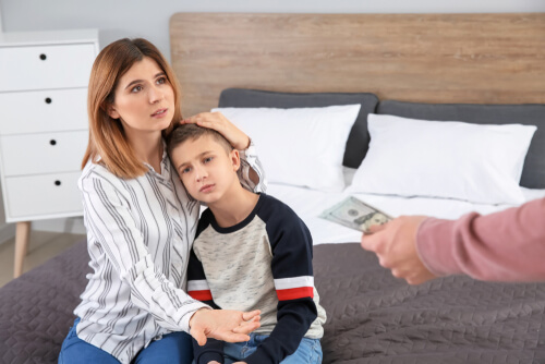 Mother holds son near during divorce argument