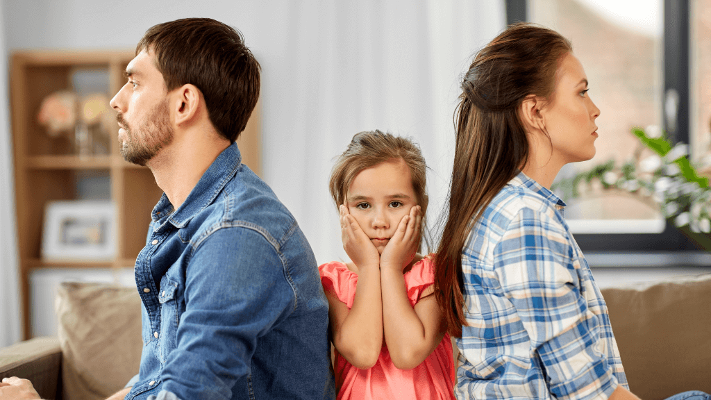 Child Stuck Between Arguing Parents